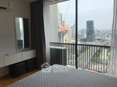 Modern bedroom with city view and large windows in high-rise apartment