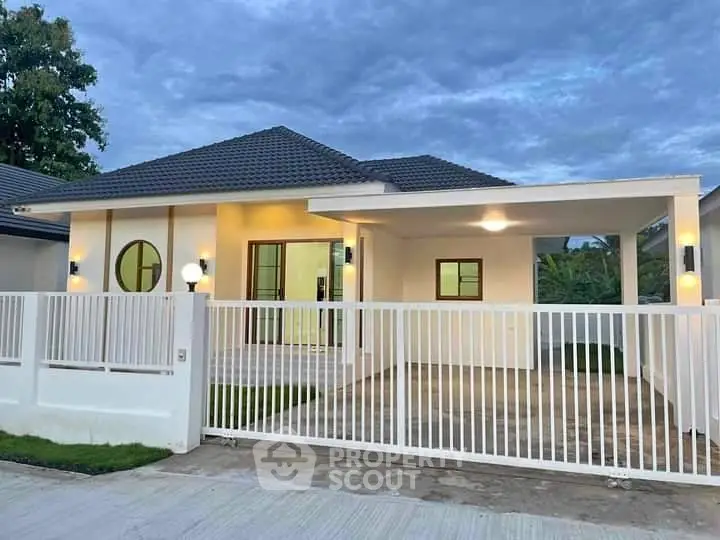 Charming single-story home with modern design and spacious driveway, perfect for family living.