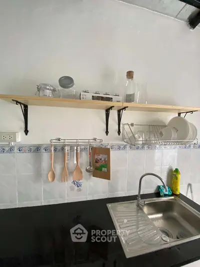 Charming kitchen with open shelving and modern sink design