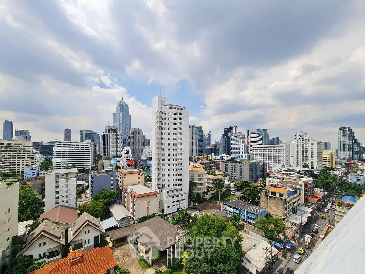 Stunning cityscape view showcasing modern skyscrapers and residential buildings under a vibrant sky.