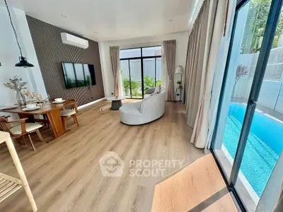 Luxurious living room with pool view and elegant decor