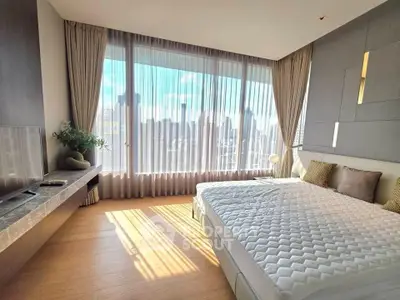 Luxurious bedroom with panoramic city view and elegant decor