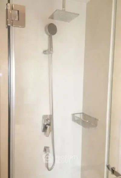 Modern bathroom shower with sleek fixtures and glass door