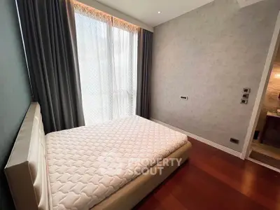 Modern bedroom with large window and elegant decor