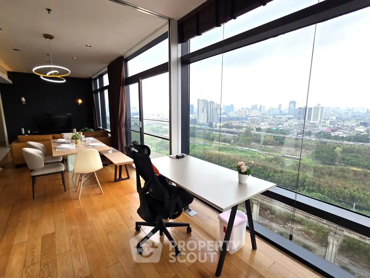 Spacious modern living room with panoramic city view and elegant wooden flooring.