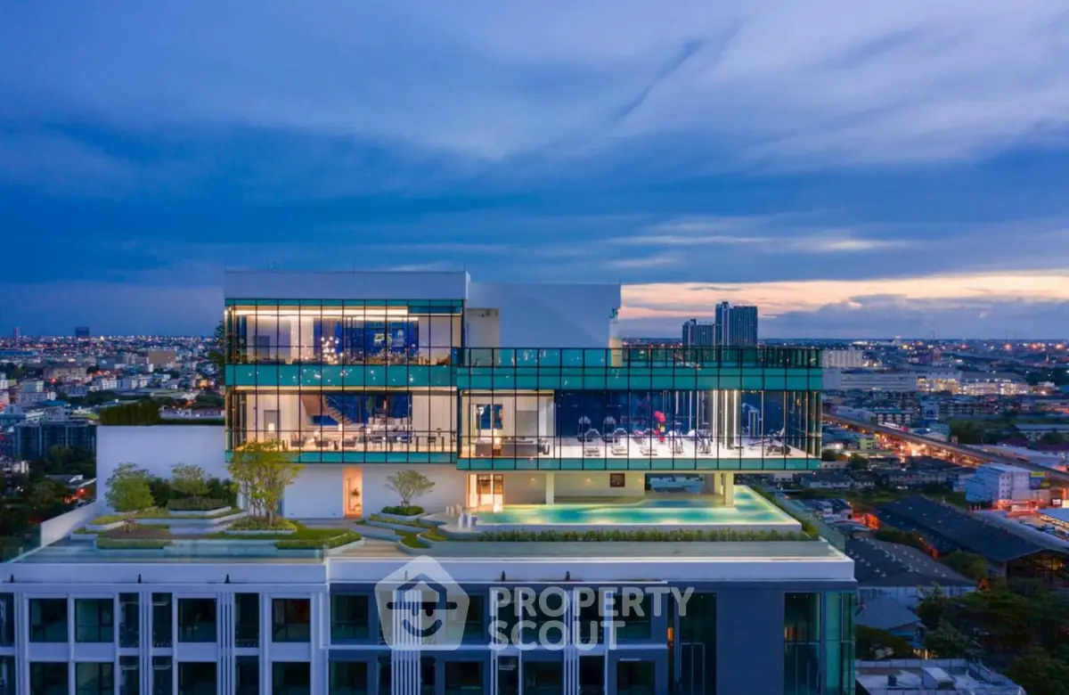 Stunning rooftop view of modern building with panoramic cityscape at dusk.