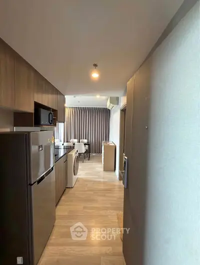 Modern kitchen with sleek appliances and open layout in stylish apartment
