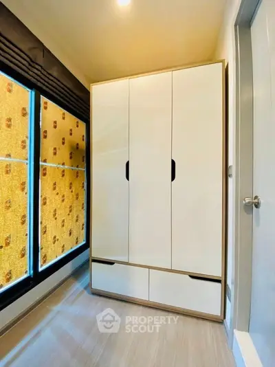 Modern wardrobe in a stylish bedroom with natural light