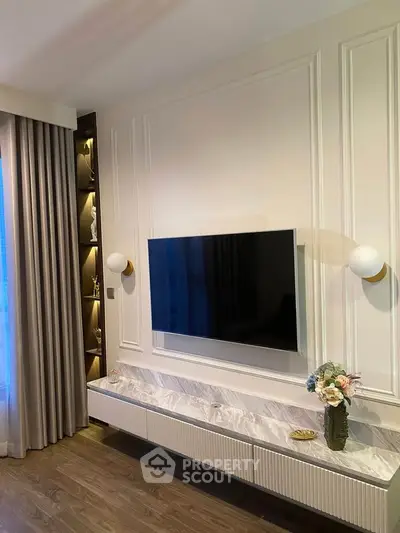 Elegant living room with modern TV setup and stylish decor