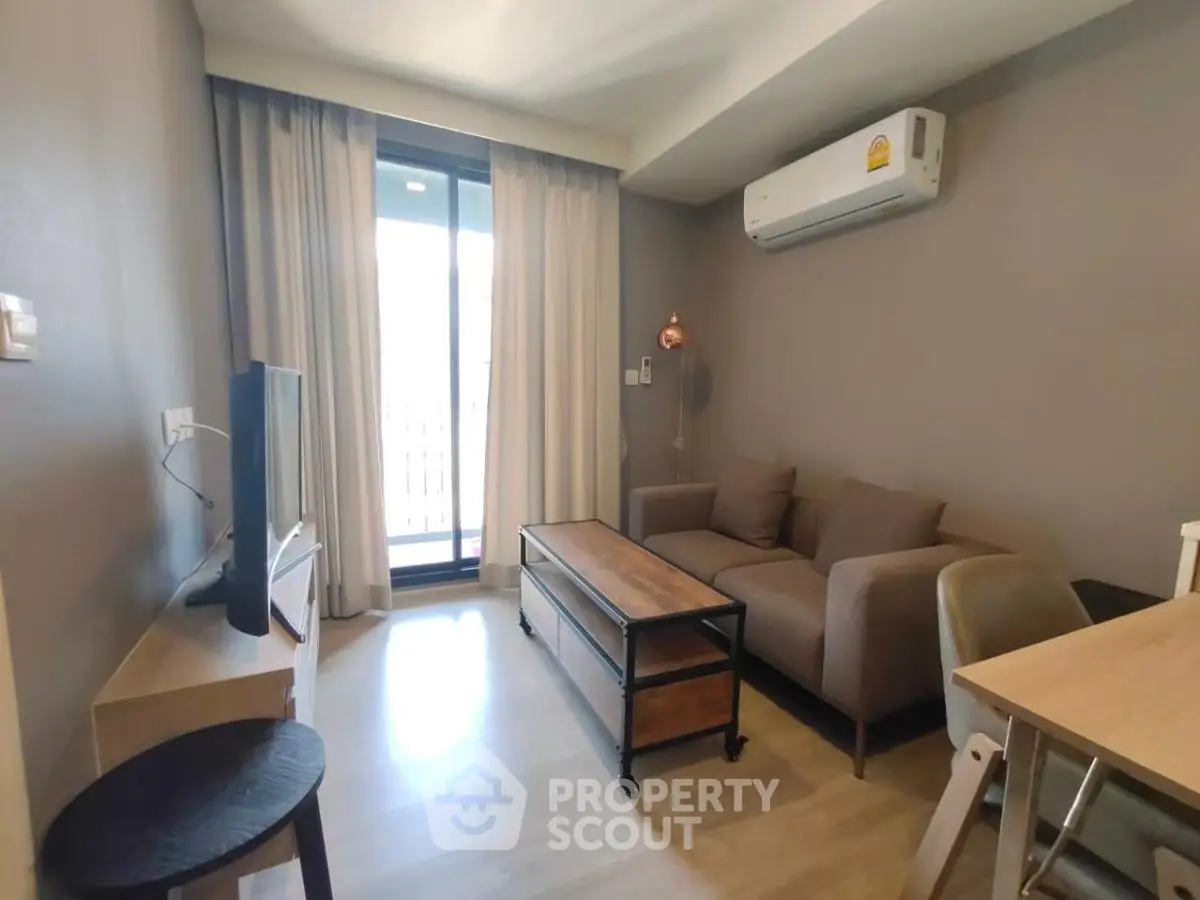 Modern living room with air conditioning and balcony access