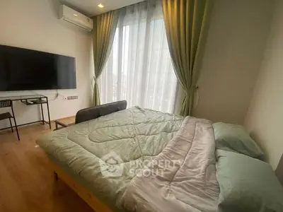 Modern bedroom with large window, green curtains, and wall-mounted TV in a stylish apartment.
