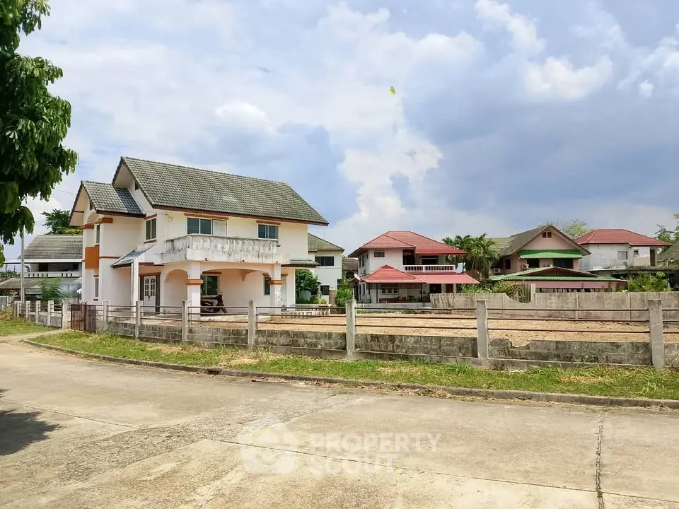Charming suburban house with spacious yard and scenic neighborhood view.