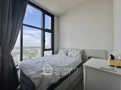 Cozy bedroom with stunning city view and large window