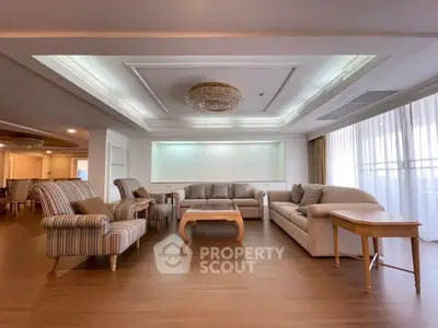 Spacious living room with elegant ceiling design and cozy seating area.