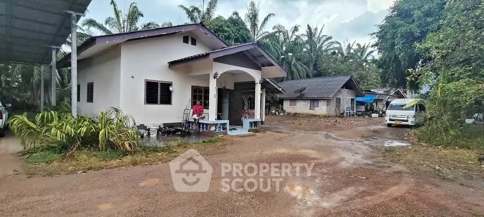 Charming rural home with spacious yard and lush greenery, perfect for serene living.
