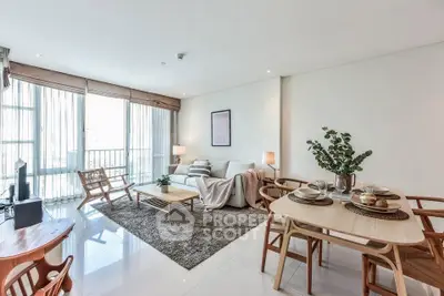 Spacious and modern living room with elegant decor and natural light