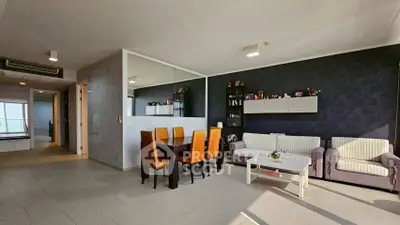 Spacious modern living room with elegant dining area and stylish decor