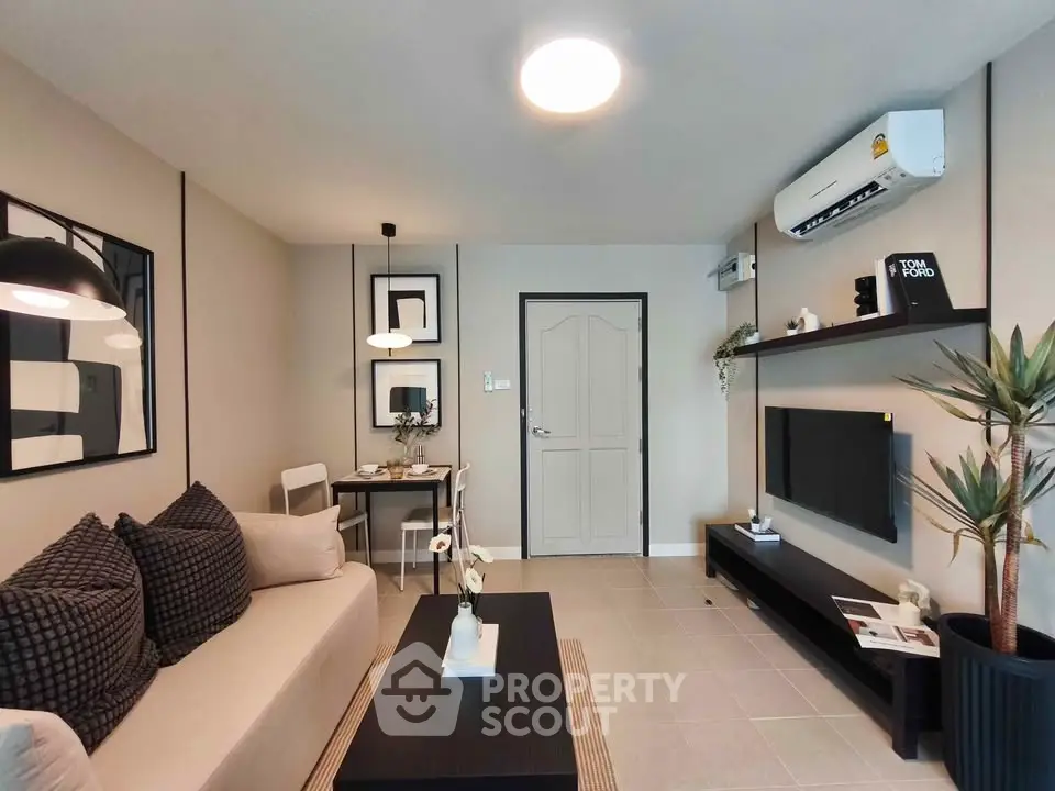 Modern living room with stylish decor and air conditioning