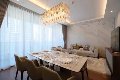 Luxurious modern living room with elegant dining area and stunning chandelier