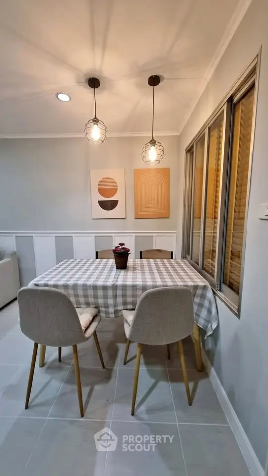 Charming dining area with modern decor and cozy ambiance, perfect for intimate gatherings.