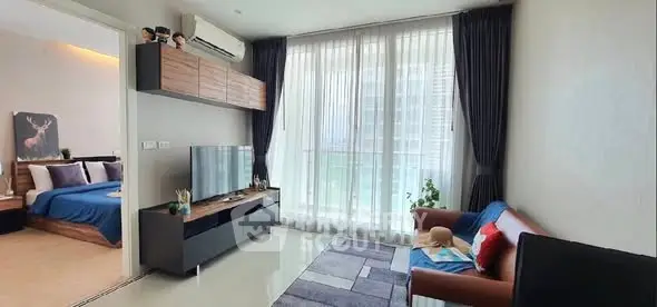 Modern living room with sleek furniture and large window for natural light