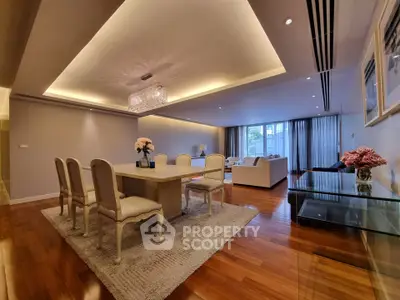 Luxurious open-plan living and dining area with elegant decor and ambient lighting