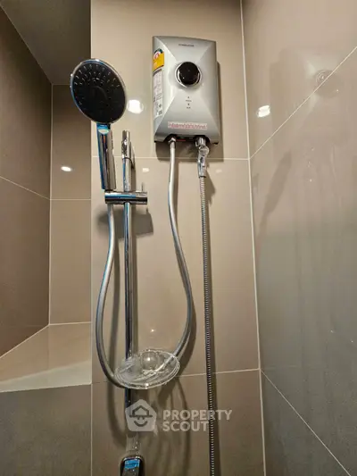 Modern bathroom shower with sleek water heater and chrome fixtures