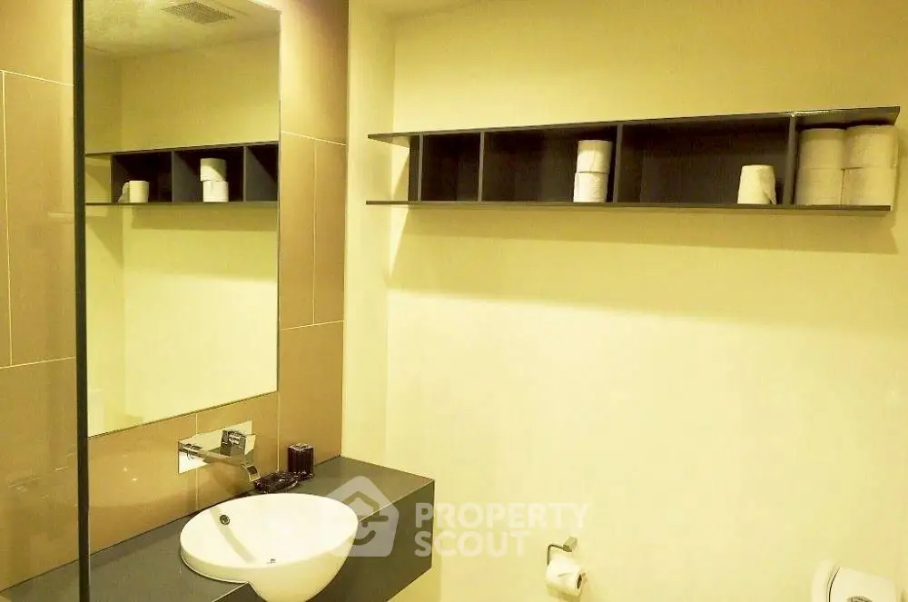 Modern bathroom with sleek design and wall-mounted sink