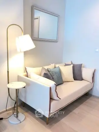 Stylish living room corner with modern sofa and elegant floor lamp