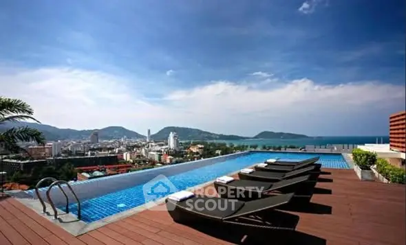 Luxurious rooftop pool with stunning city and ocean views, perfect for relaxation and leisure.