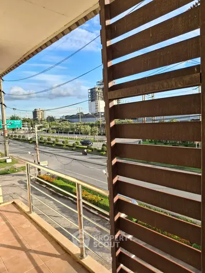 Spacious balcony with city view and modern railing design