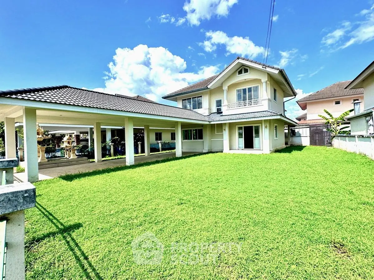 Spacious two-story house with lush green lawn and covered patio in a serene neighborhood.