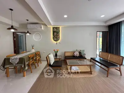 Spacious living room with modern furniture and dining area