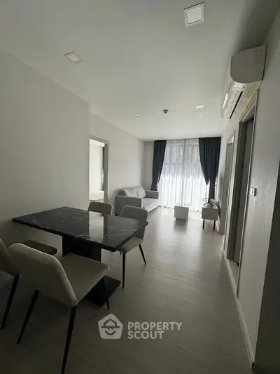 Modern apartment interior with dining area and natural light
