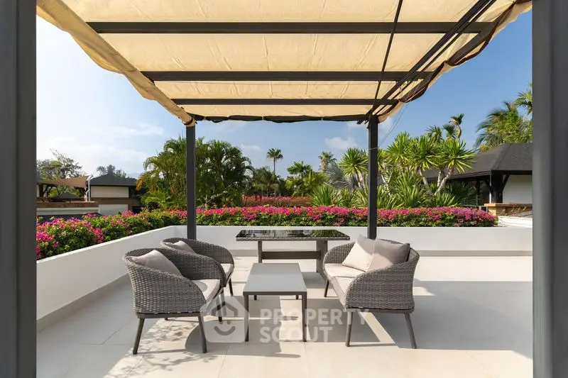 Luxurious rooftop terrace with elegant seating and lush garden views