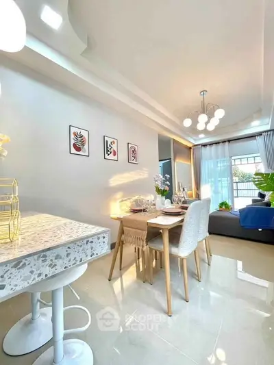 Modern dining area with elegant decor and natural light, perfect for entertaining guests.