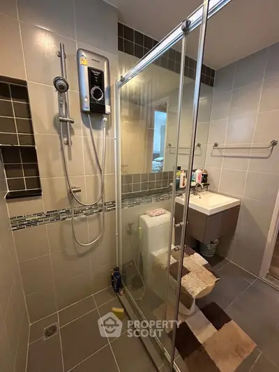 Modern bathroom with glass shower and sleek fixtures