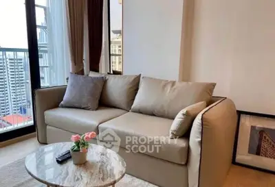 Modern living room with cozy sofa and city view balcony in high-rise apartment.