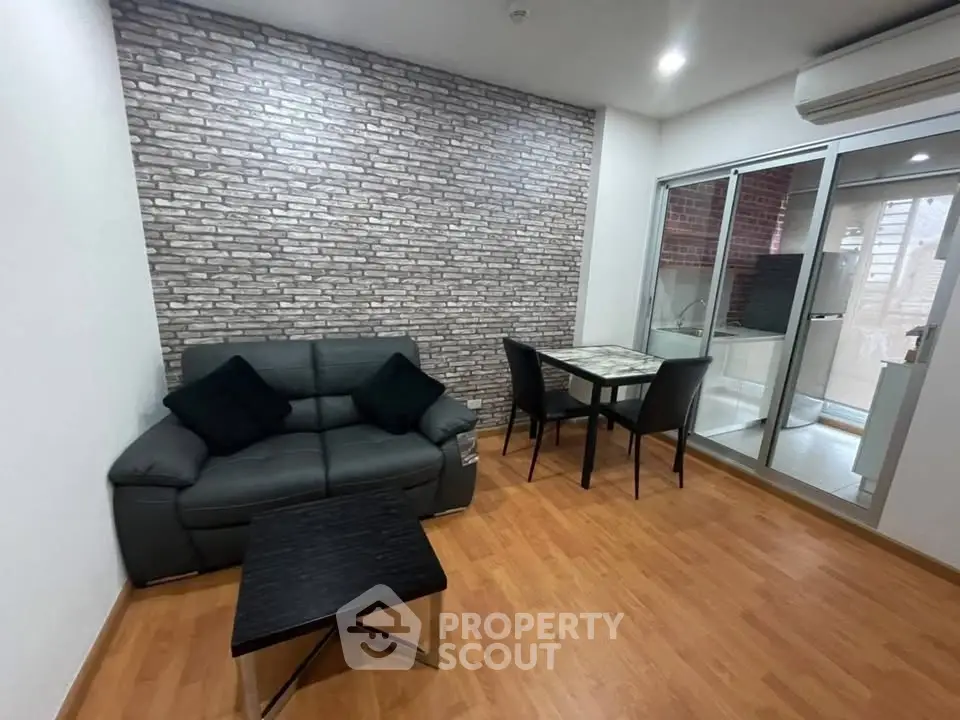 Modern living room with stylish brick accent wall and cozy seating area