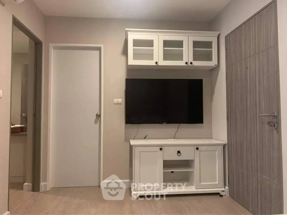 Modern living room with sleek TV unit and stylish cabinetry