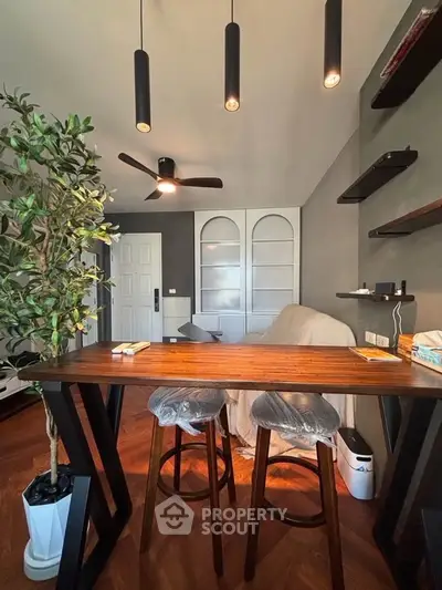 Modern living room with stylish furniture and elegant lighting, perfect for cozy gatherings.