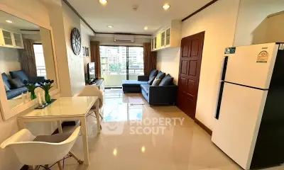 Spacious living room with modern decor and balcony view in urban apartment.