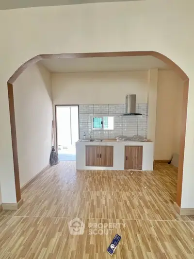 Charming kitchen with open layout and modern wood flooring