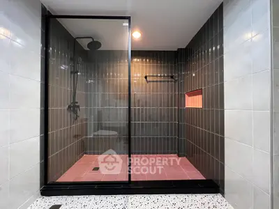 Modern bathroom with sleek glass shower and stylish tile design