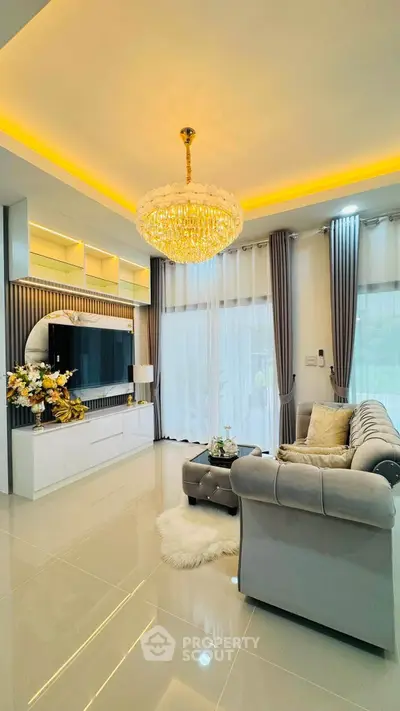 Luxurious living room with elegant chandelier and modern decor