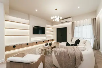 Luxurious modern living room with elegant lighting and cozy seating area.