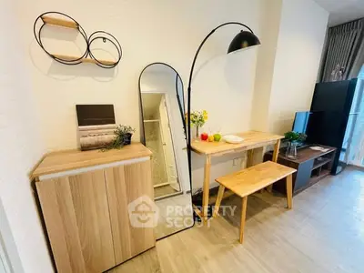 Modern living room with stylish furniture and decor, featuring a sleek floor lamp and wooden accents.