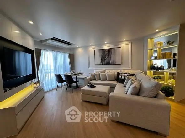 Modern living room with elegant decor, spacious seating, and ambient lighting, perfect for relaxation and entertainment.