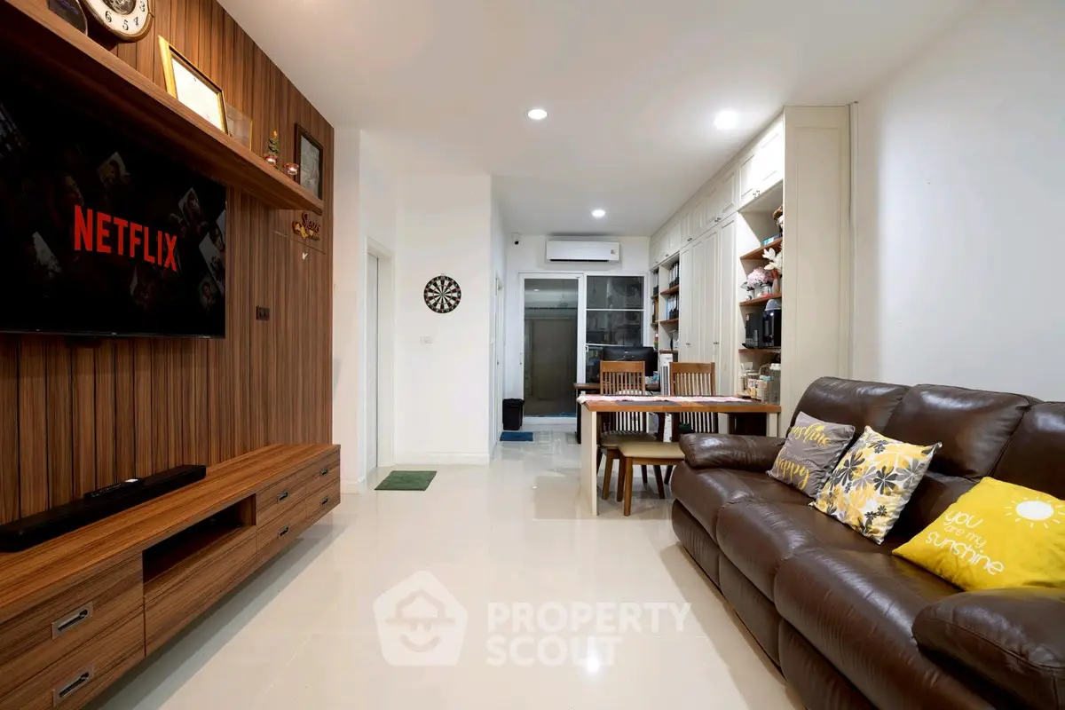 Modern living room with stylish decor and cozy seating area, perfect for relaxation and entertainment.