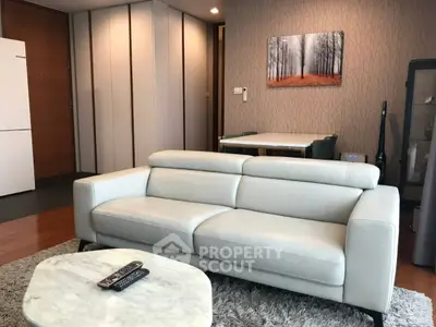 Modern living room with sleek white sofa and stylish decor